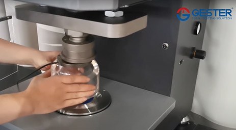 Rubber diaphragm and fixture installation on a bursting strength tester
