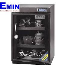 Technician checking humidity performance of a dry cabinet in a laboratory setting