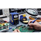 Which soldering station is suitable for an electrical cabinet maintenance workshop, and how does it differ from a mobile phone repair soldering station?