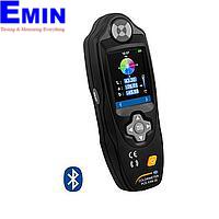 Technician handling a handheld color measurement instrument for service and inspection