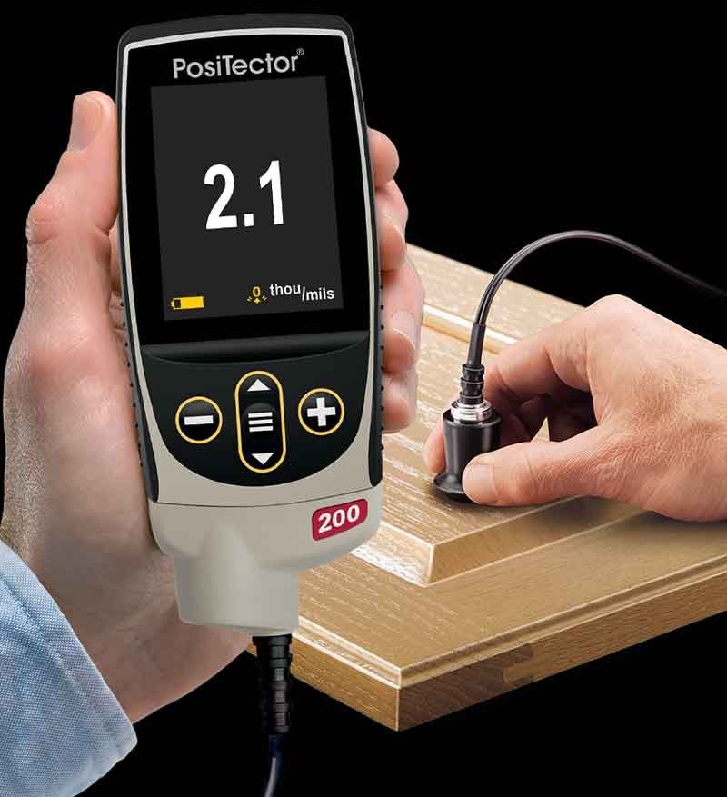 PosiTector 200 B measuring coating thickness on a non-metal surface